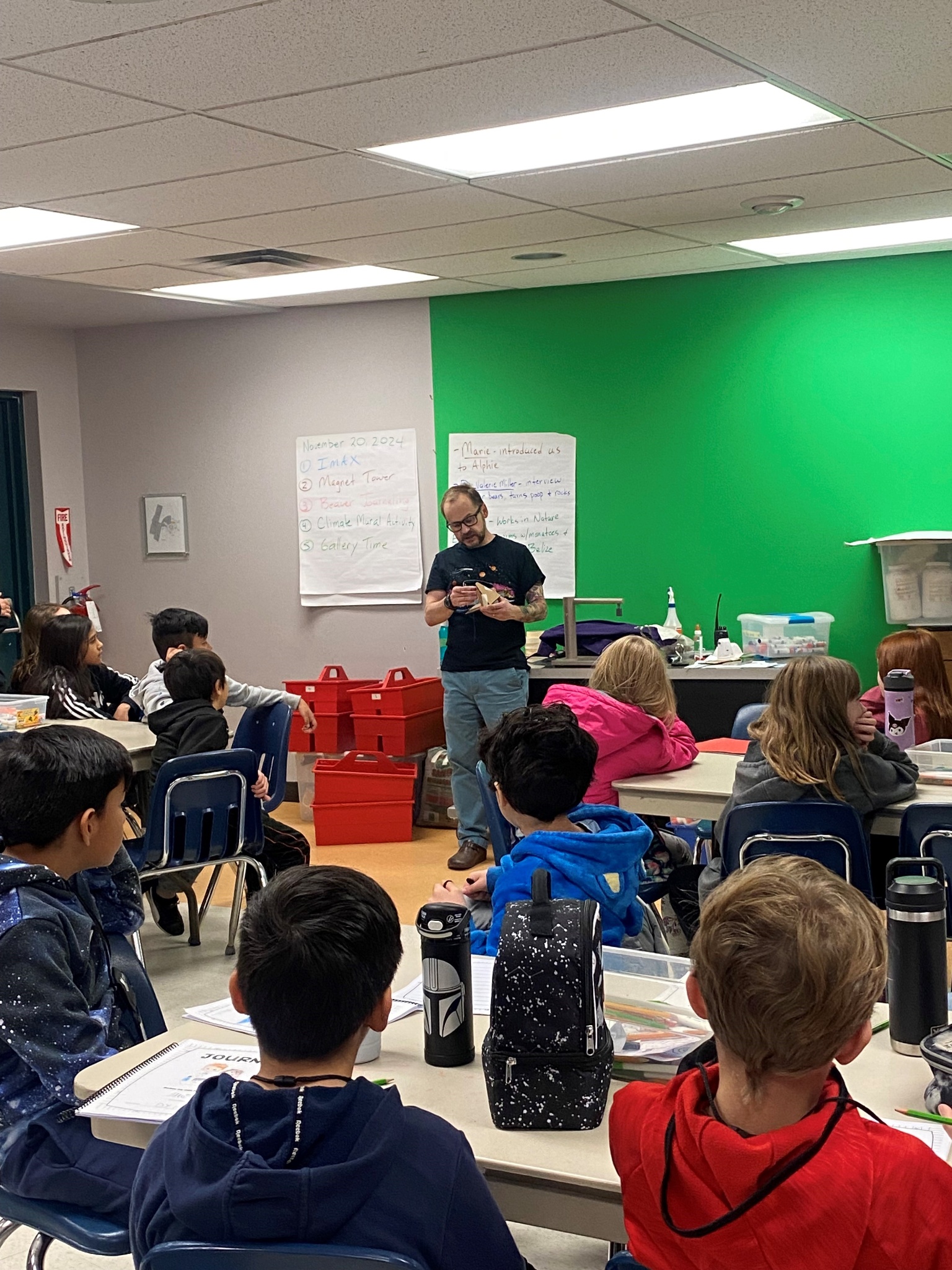 A  teacher is demonstrating an experiment to a class at t Teresa Science School