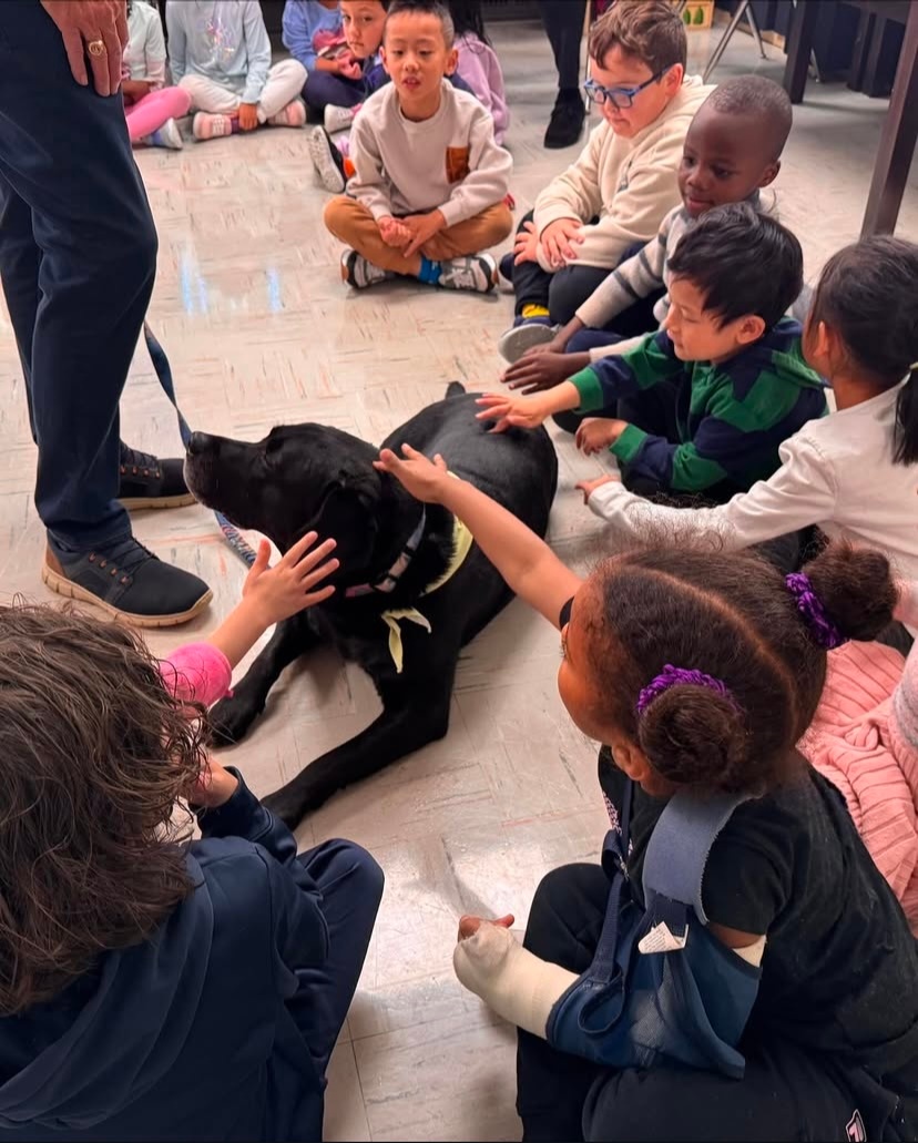 St Leo Students with a wellness dog