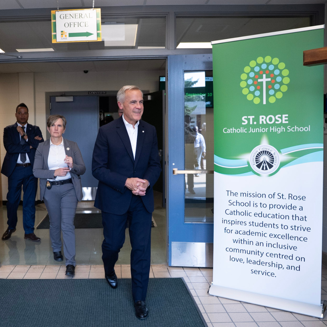 Prime Minister Mark Carney walks into St Rose Catholic Junior High School