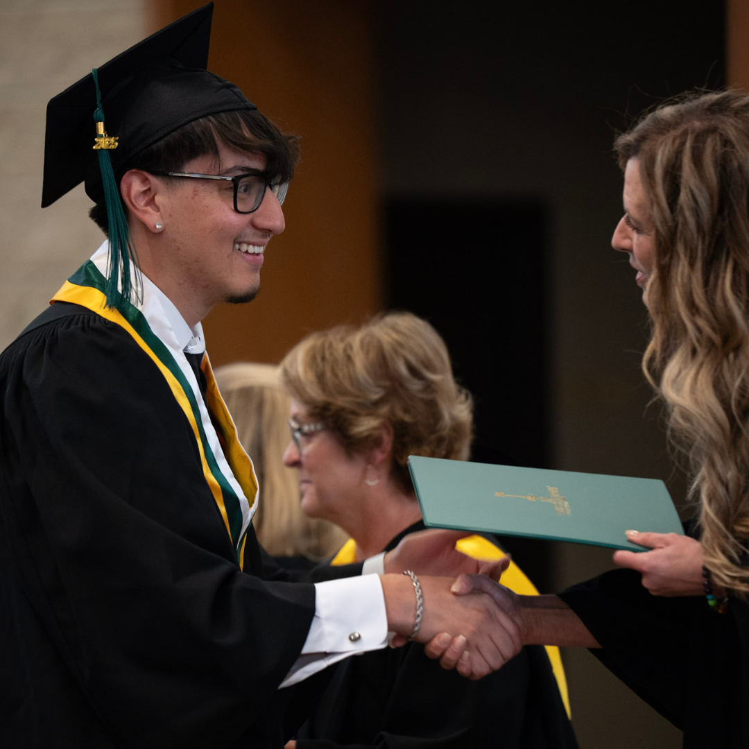 Student receiving a diploma