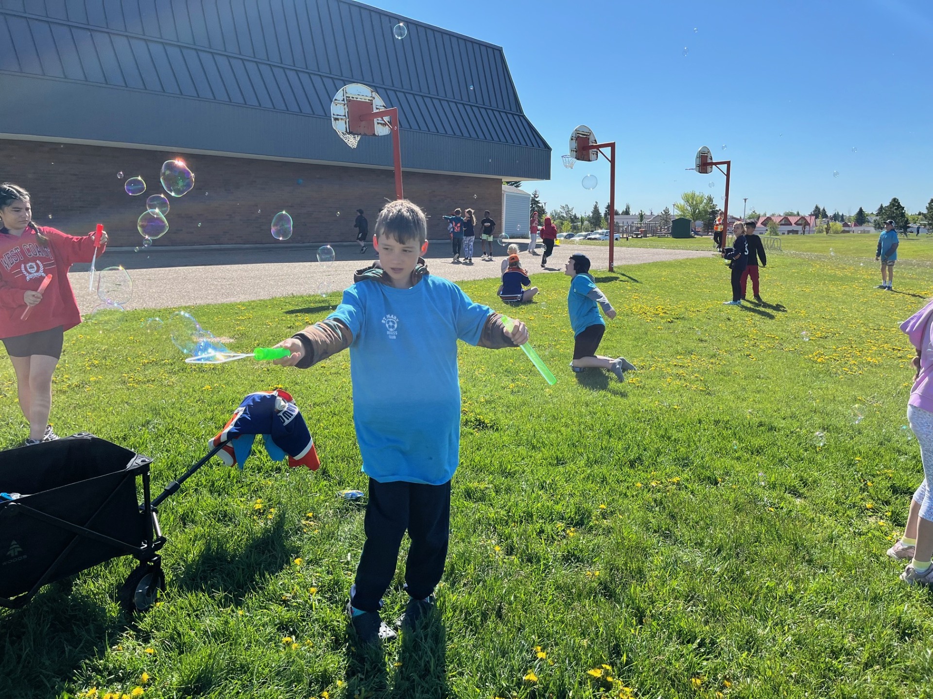 Students playing with bubbles at St. Mary Recess Club
